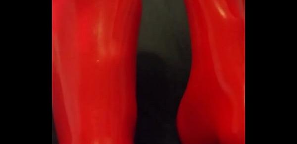  Shiny red latex rubber stockings closeup